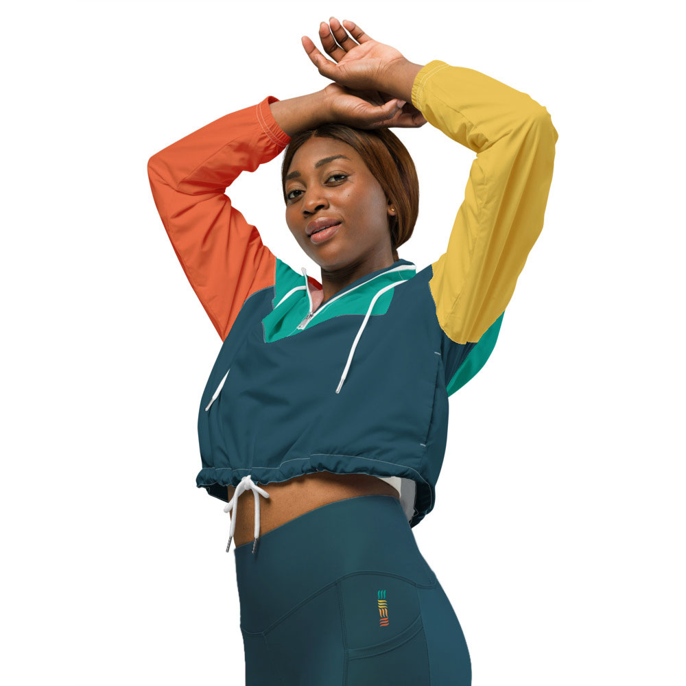 a woman wearing Hero Basics cropped windbreaker with her hands on her head