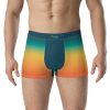 a man wearing a colorful pair of hero in training boxer briefs