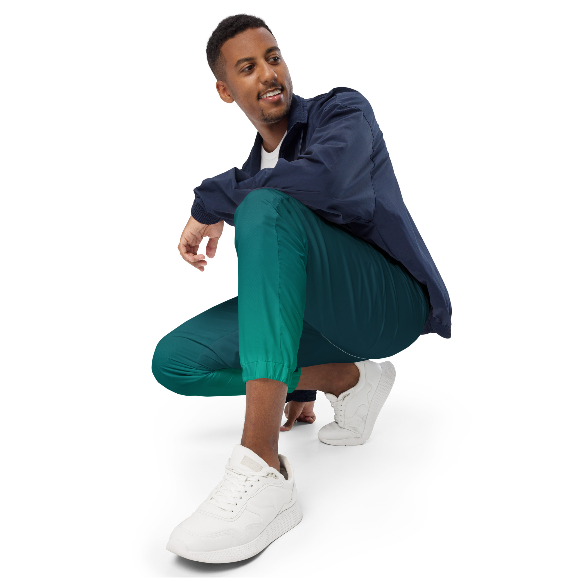 Hero in Training Men's Track Pants a man squatting while wearing Hero in Training men's track pants.