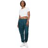 a woman in a white shirt and and dark teal blue Hero Basics Unisex Track Pants